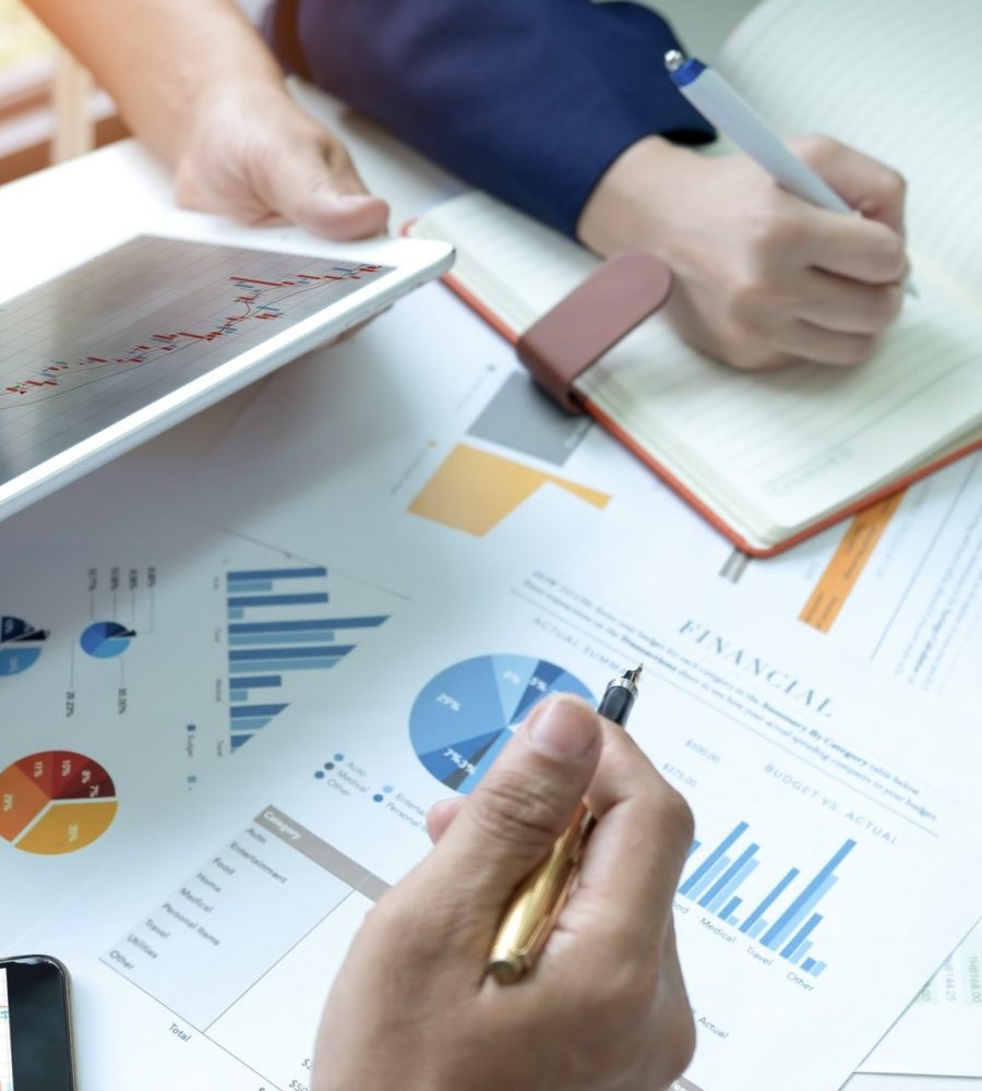 Businessteam are analyzing graphs.